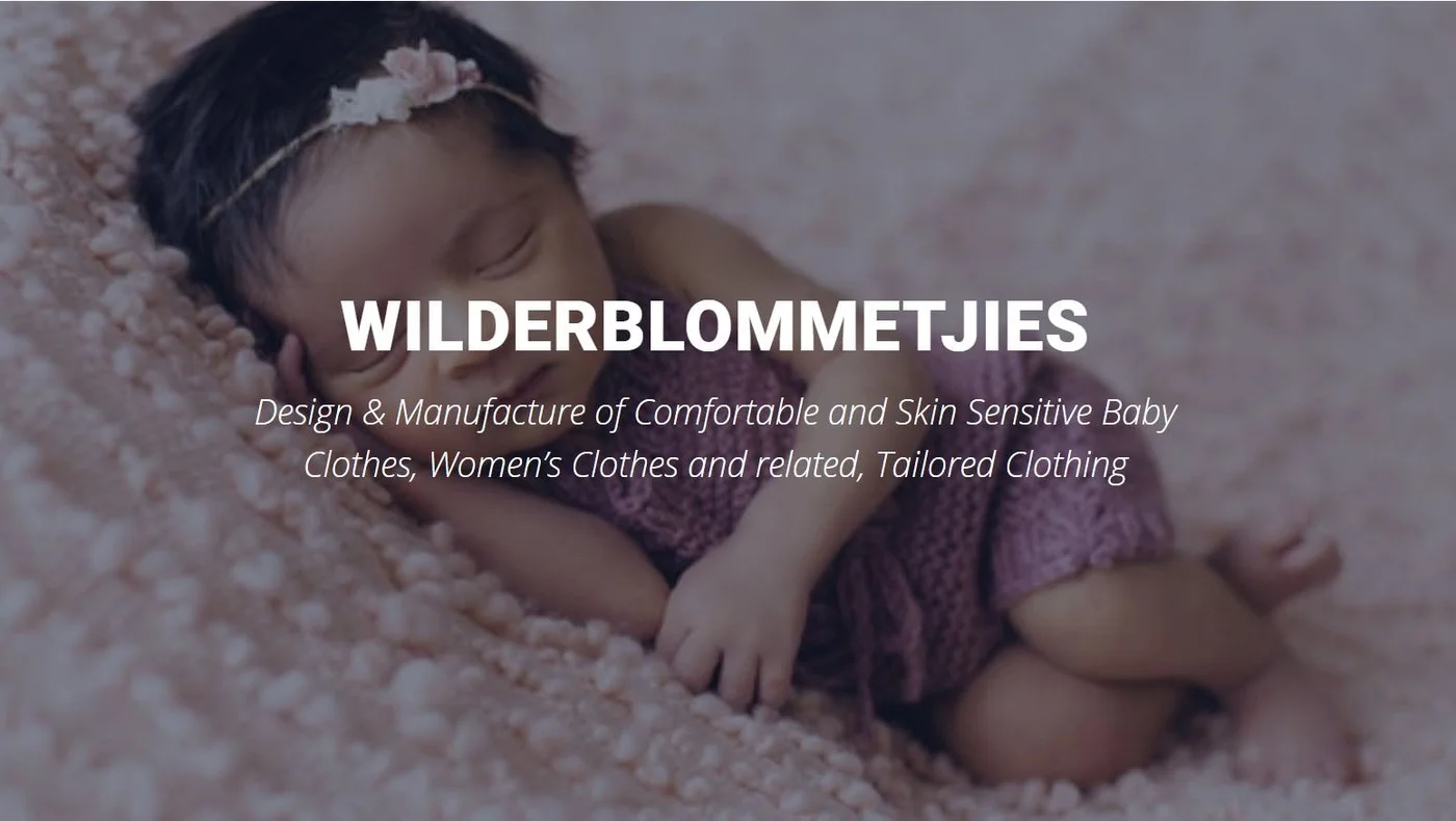 Sleeping newborn with the Wilderblommetjies wordmark, Design and Manufacture of Comfortable and Skin Sensitive Baby Clothes
